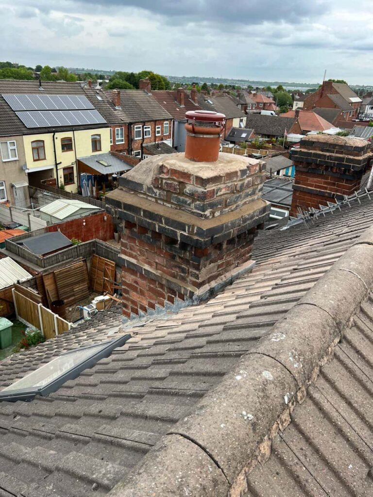 This is a photo taken from a roof which is being repaired by Huntingdon Roofing Repairs, it shows a street of houses, and their roofs